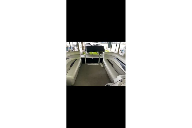 Slide: The Image of Interior of a 2012 Sweetwater 2086 pontoon boat with seating and storage. - 15
