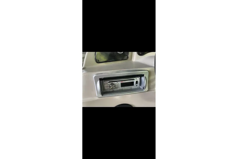 Slide: The Image of 2012 Sweetwater 2086 boat dashboard with stereo system. - 17