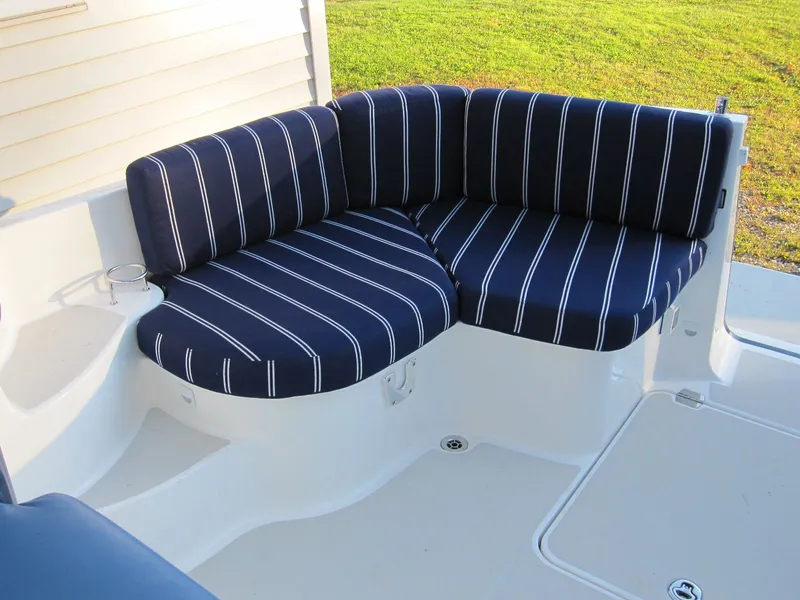 Slide: The Image of 2011 Back Cove 30 boat seating with blue striped cushions. - 24