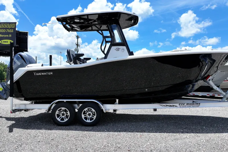 The Image of 2026 Tidewater 232 LXF boat on trailer under blue sky. - 0