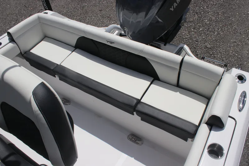 Slide: The Image of 2026 Tidewater 232 LXF boat interior with cushioned seating and Yamaha engine. - 15