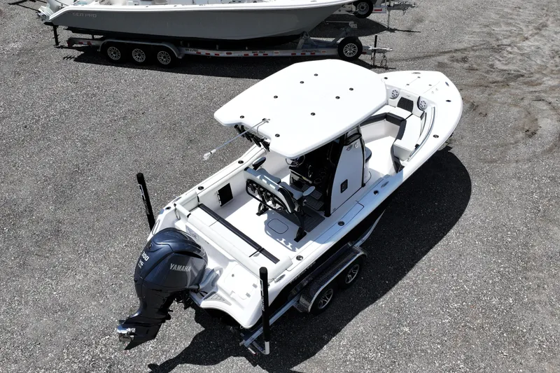Slide: The Image of 2026 Tidewater 232 LXF boat on trailer, featuring Yamaha outboard motor. - 3