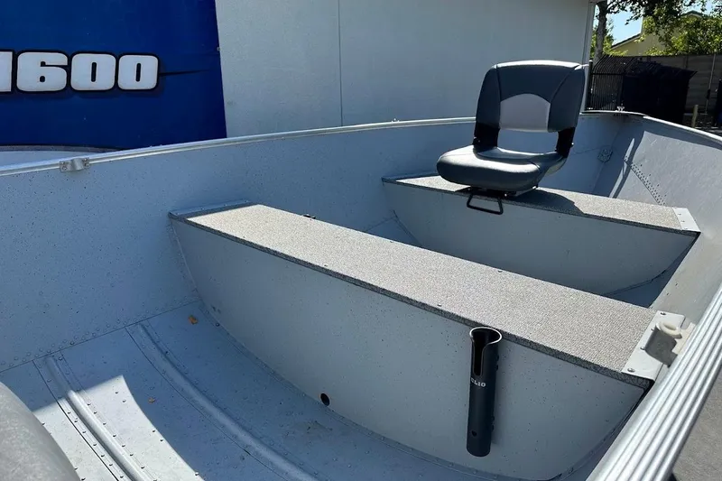Slide: The Image of 2024 Lund WC-14 boat interior with seating and storage compartments. - 10