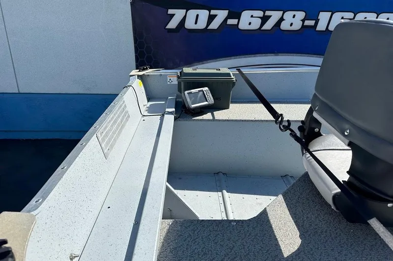 Slide: The Image of 2024 Lund WC-14 boat interior with seating and equipment, showcasing durable design. - 12