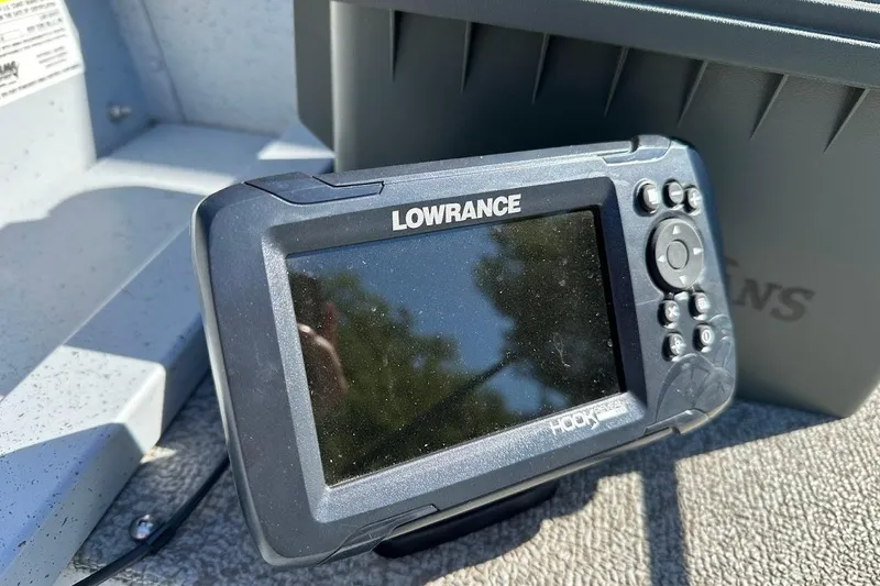 Slide: The Image of Lowrance Hook fish finder on 2024 Lund WC-14 boat, close-up view. - 14