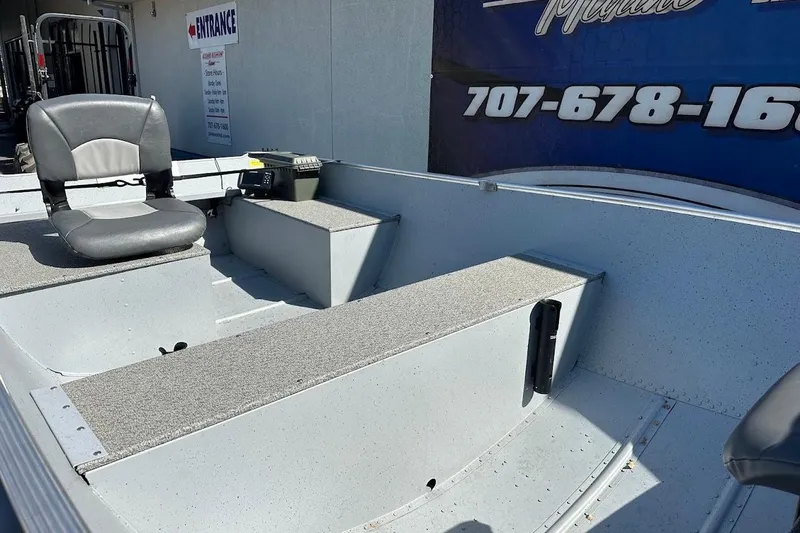 Slide: The Image of 2024 Lund WC-14 boat interior with seating and storage compartments. - 9