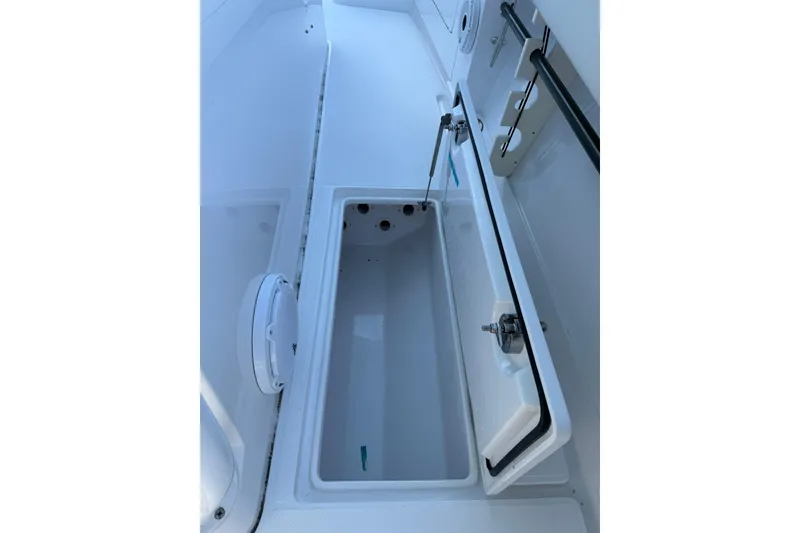 Slide: The Image of Open storage compartment on a 2021 Jupiter 38 HFS boat, showcasing interior space. - 15