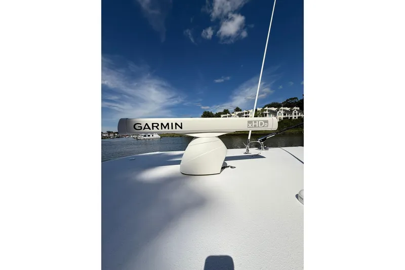 Slide: The Image of Garmin xHD2 radar on 2021 Jupiter 38 HFS boat under clear blue sky. - 17