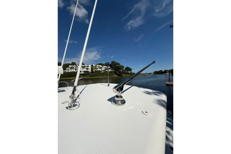 Slide: The Image of 2021 Jupiter 38 HFS boat deck with clear blue sky and waterfront view. - 18