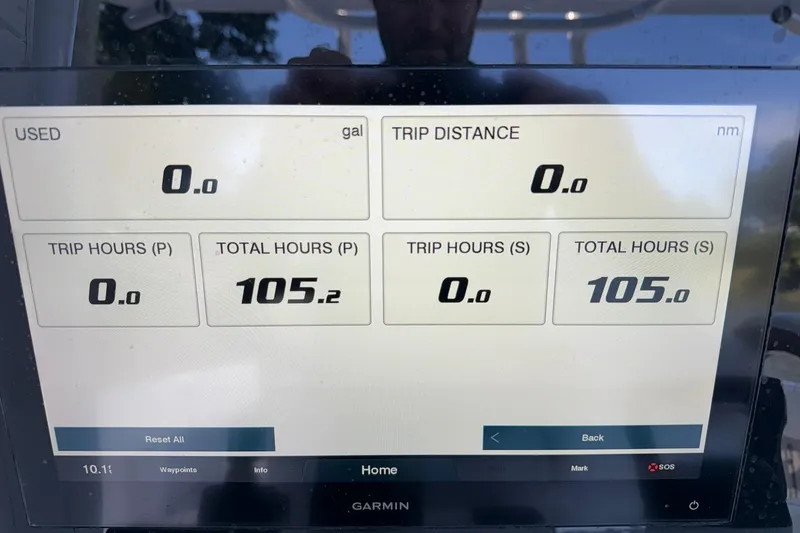 Slide: The Image of Dashboard display of a 2021 Jupiter 38 HFS showing trip and total hours. - 26