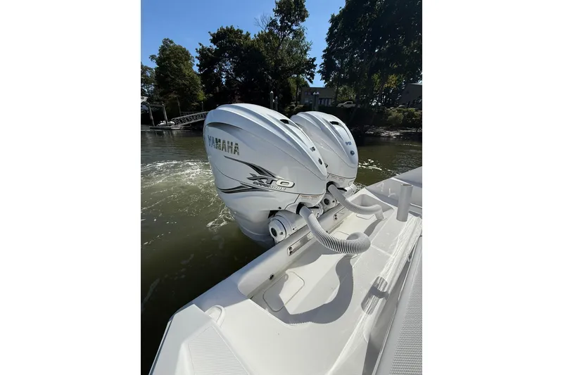 Slide: The Image of 2021 Jupiter 38 HFS boat with dual Yamaha XTO outboard engines on water. - 29