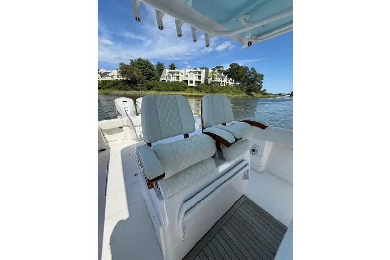 Slide: The Image of Luxury seating on 2021 Jupiter 38 HFS boat, with scenic waterfront view. - 31