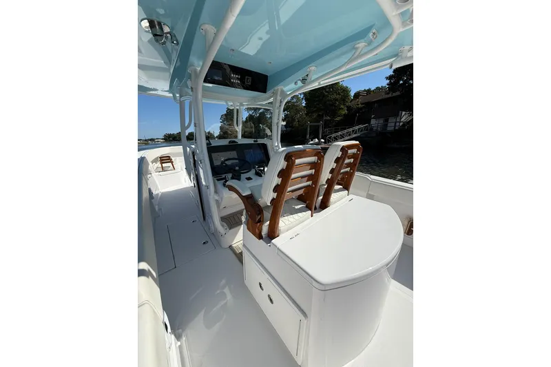 Slide: The Image of 2021 Jupiter 38 HFS boat interior with helm, seating, and sleek design. - 35