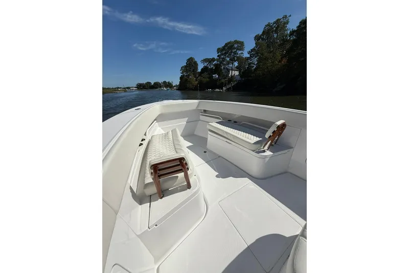 Slide: The Image of 2021 Jupiter 38 HFS boat interior with seating, cruising on a sunny day. - 36