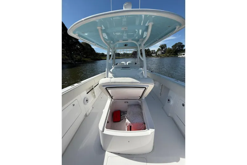 Slide: The Image of 2021 Jupiter 38 HFS boat interior with open storage compartment on a sunny day. - 39