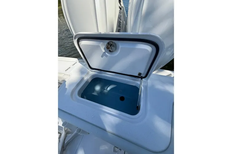 Slide: The Image of Open storage compartment on 2021 Jupiter 38 HFS boat, showing interior details. - 43