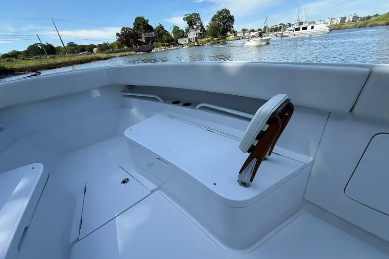 Slide: The Image of 2021 Jupiter 38 HFS boat interior with seating, on a calm waterway. - 48