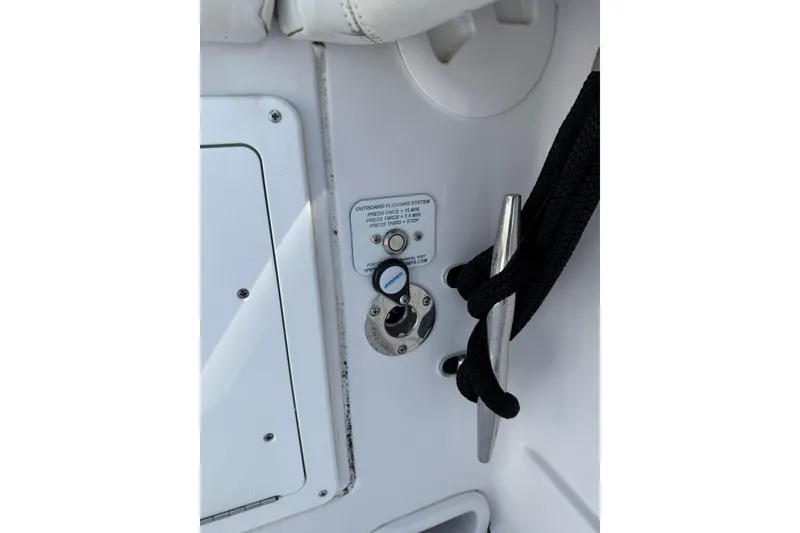 Slide: The Image of 2021 Jupiter 38 HFS boat detail with cleat and outboard flushing system. - 49