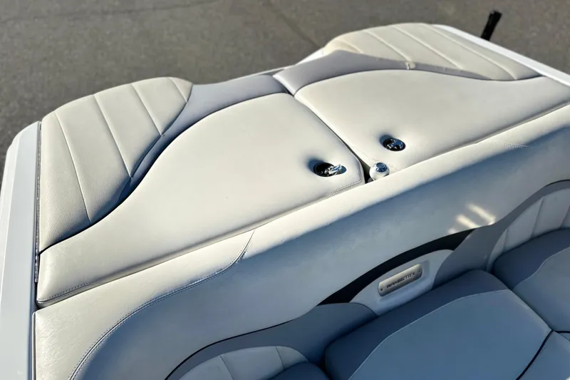 Slide: The Image of 2008 Malibu Boats 23 LSV interior seating, featuring sleek, light gray upholstery design. - 14