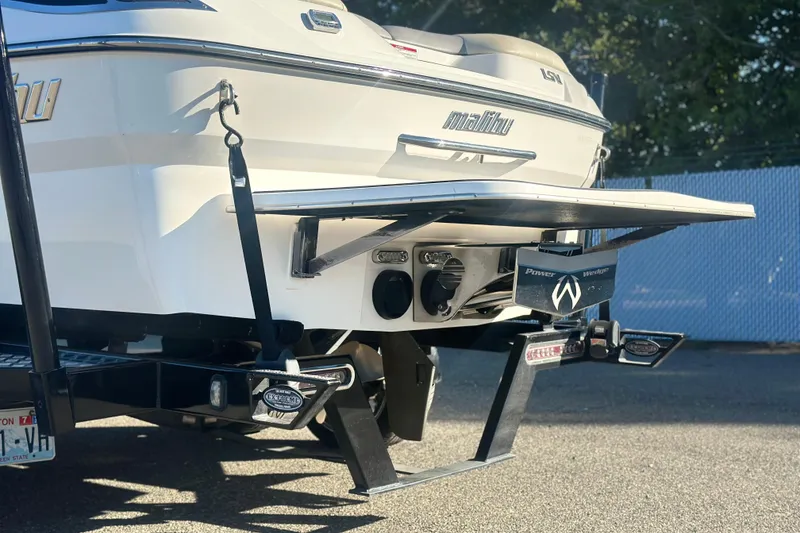 Slide: The Image of 2008 Malibu Boats 23 LSV rear view with swim platform and trailer. - 4