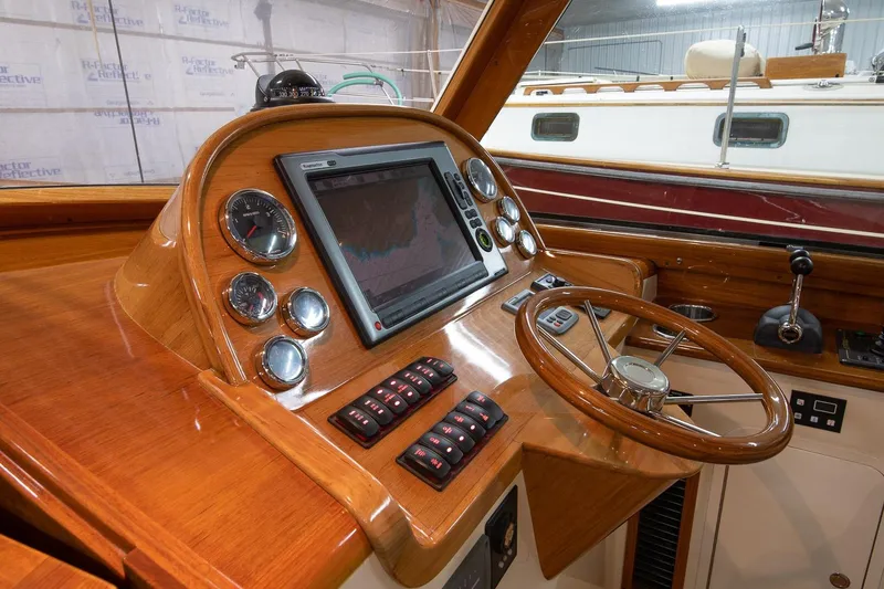 Slide: The Image of Hinckley Picnic Boat 37 MKIII 2011 galley with sink, stove, and microwave. - 8
