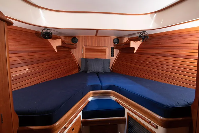 Slide: The Image of Hinckley Picnic Boat 37 MKIII 2011 interior with wooden cabinetry and compact toilet. - 11