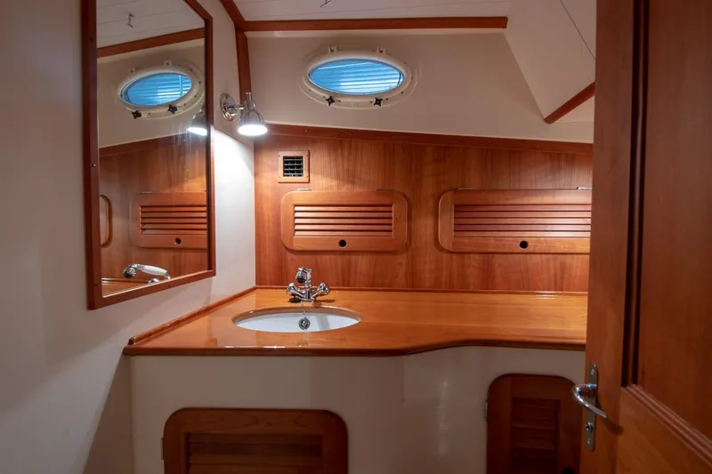 Slide: The Image of Hinckley Picnic Boat 37 MKIII, 2011, docked with scenic waterfront view. - 12