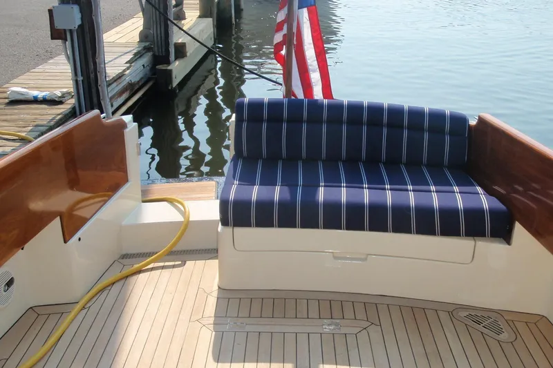 Slide: The Image of 2011 Hinckley Picnic Boat 37 MKIII on calm water, side view. - 14