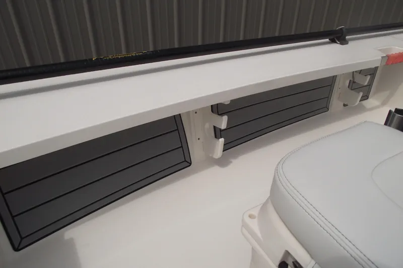 Slide: The Image of 2024 Hewes Redfisher 16 interior with rod holders and seating detail. - 11