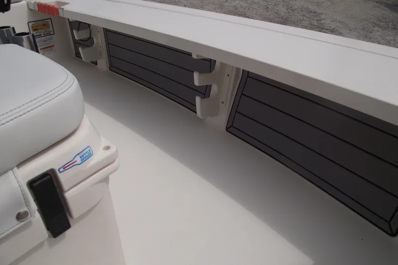 Slide: The Image of 2024 Hewes Redfisher 16 interior with seating and storage compartments. - 12