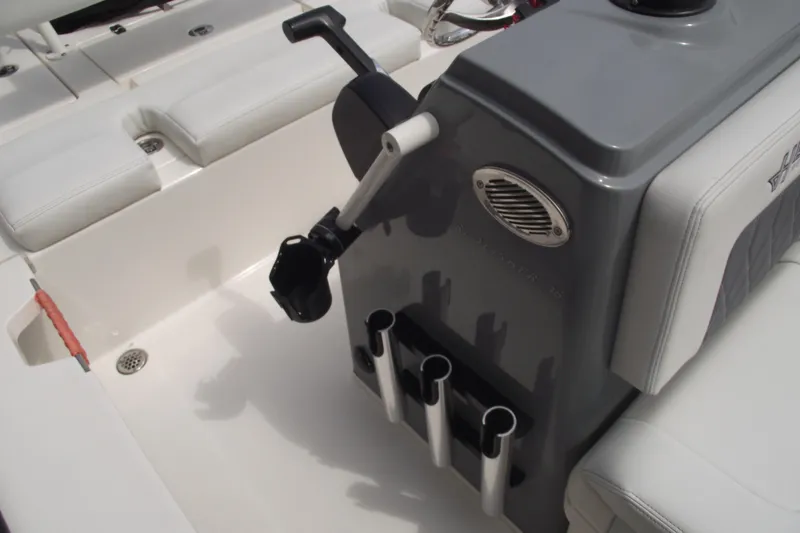 Slide: The Image of 2024 Hewes Redfisher 16 boat interior with rod holders and seating. - 13