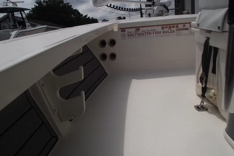 Slide: The Image of 2024 Hewes Redfisher 16 interior with saltwater fish ruler and rod holders. - 22