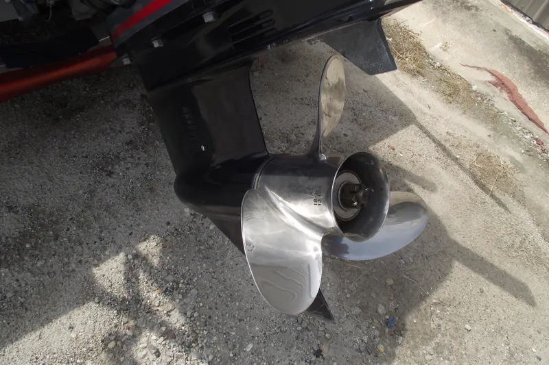 Slide: The Image of 2024 Hewes Redfisher 16 boat propeller on gravel surface. - 4