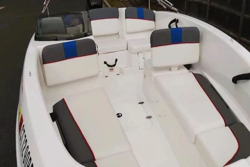 Slide: The Image of 2024 Tahoe T16 boat interior with white and gray seating, blue accents. - 3