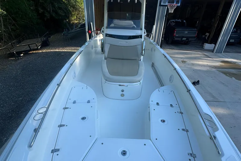 Slide: The Image of 2017 Boston Whaler 270 Dauntless boat interior with seating and storage compartments. - 1