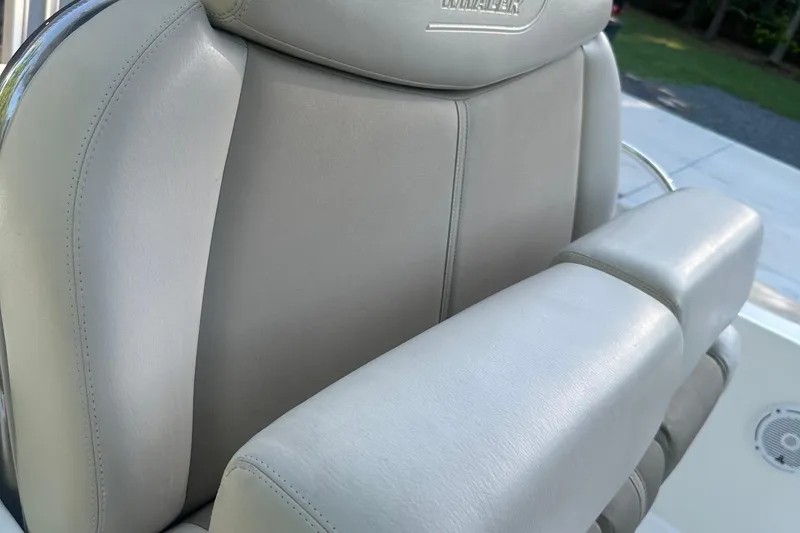 Slide: The Image of 2017 Boston Whaler 270 Dauntless boat seat with beige upholstery. - 11