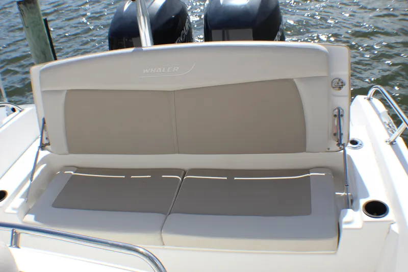Slide: The Image of 2017 Boston Whaler 270 Dauntless boat seat with dual engines in the background. - 13