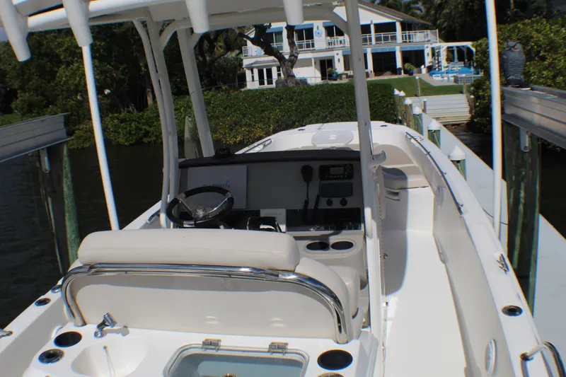 Slide: The Image of 2017 Boston Whaler 270 Dauntless boat docked near waterfront property. - 19