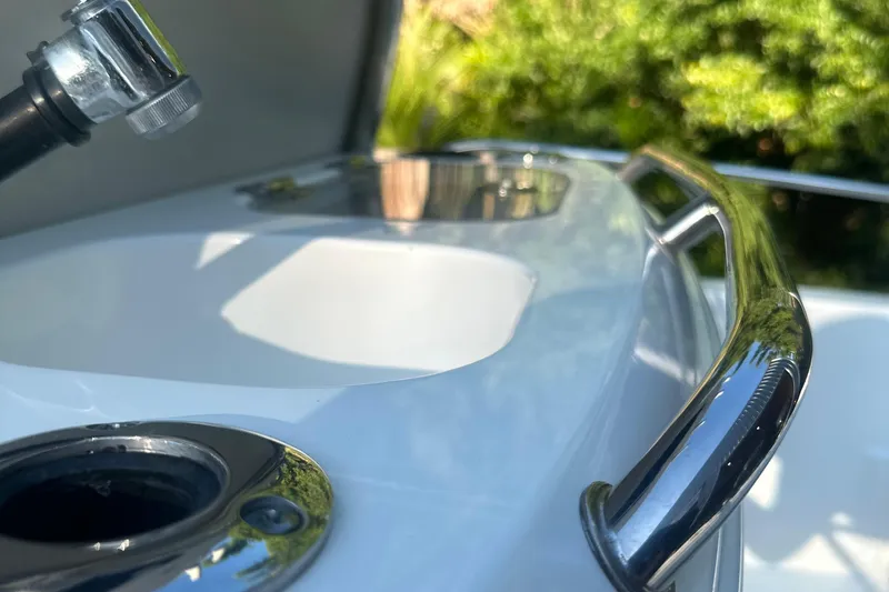 Slide: The Image of Close-up of 2017 Boston Whaler 270 Dauntless boat's sleek chrome railing and fixtures. - 2