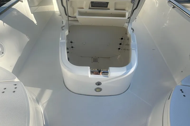 Slide: The Image of 2017 Boston Whaler 270 Dauntless boat interior with open storage compartment. - 24