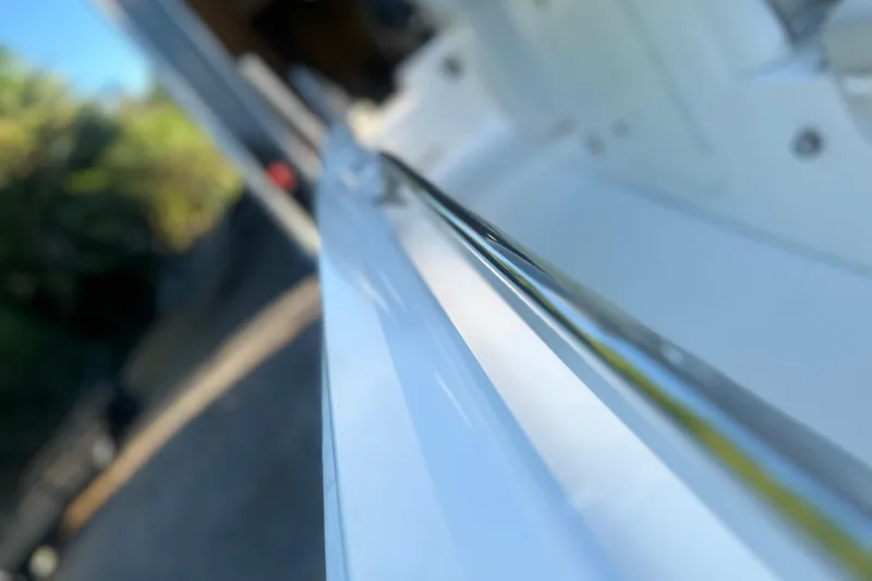 Slide: The Image of Close-up of a 2017 Boston Whaler 270 Dauntless boat railing in sunlight. - 26
