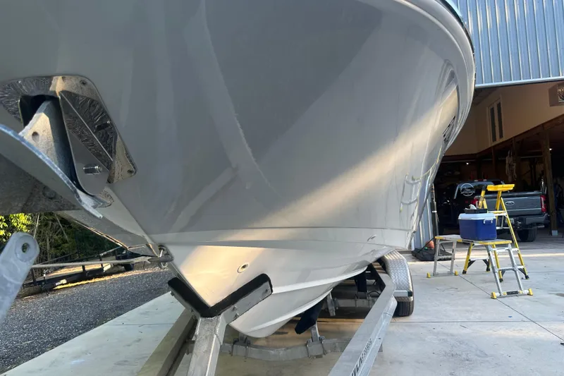 Slide: The Image of 2017 Boston Whaler 270 Dauntless boat on trailer in garage setting. - 5