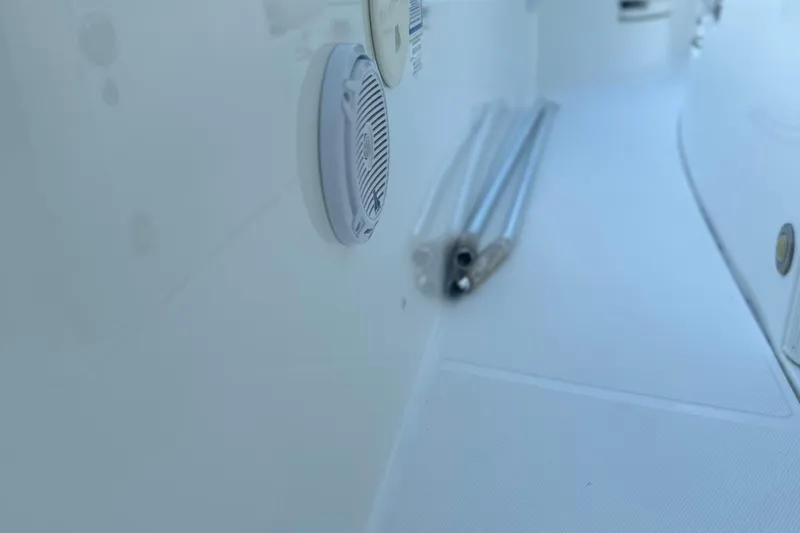 Slide: The Image of Close-up of a 2017 Boston Whaler 270 Dauntless boat interior with speaker and metal rods. - 8