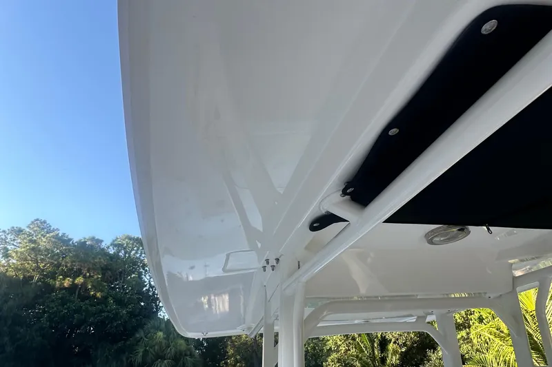 Slide: The Image of 2017 Boston Whaler 270 Dauntless boat canopy against clear blue sky. - 9