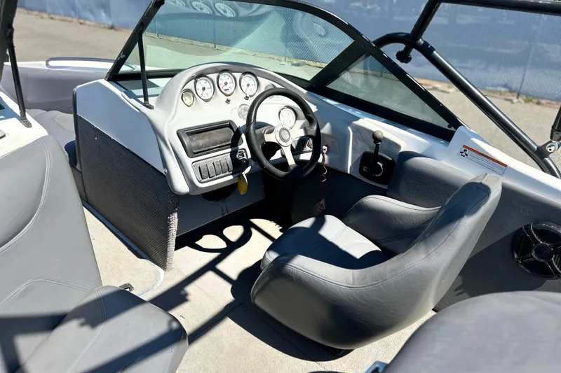 Slide: The Image of 2001 Centurion Elite Bowrider interior with steering wheel, gauges, and seating. - 10