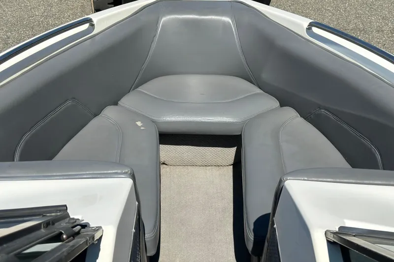 Slide: The Image of 2001 Centurion Elite Bowrider interior with gray seating and carpeted floor. - 6
