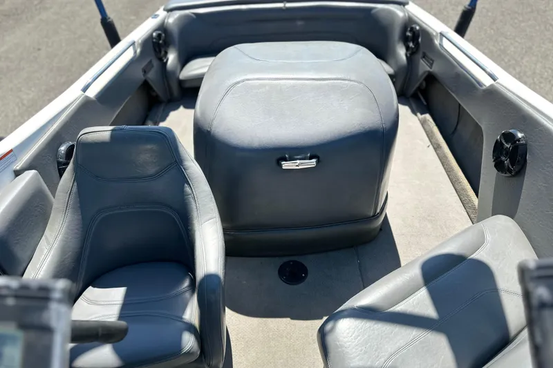 Slide: The Image of 2001 Centurion Elite Bowrider interior with gray seating and carpeted floor. - 7