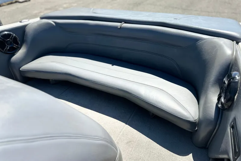 Slide: The Image of 2001 Centurion Elite Bowrider interior with gray seating and speaker. - 8