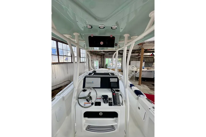 Slide: The Image of 2026 Parker 23SE Center Console boat interior with Garmin navigation system. - 8