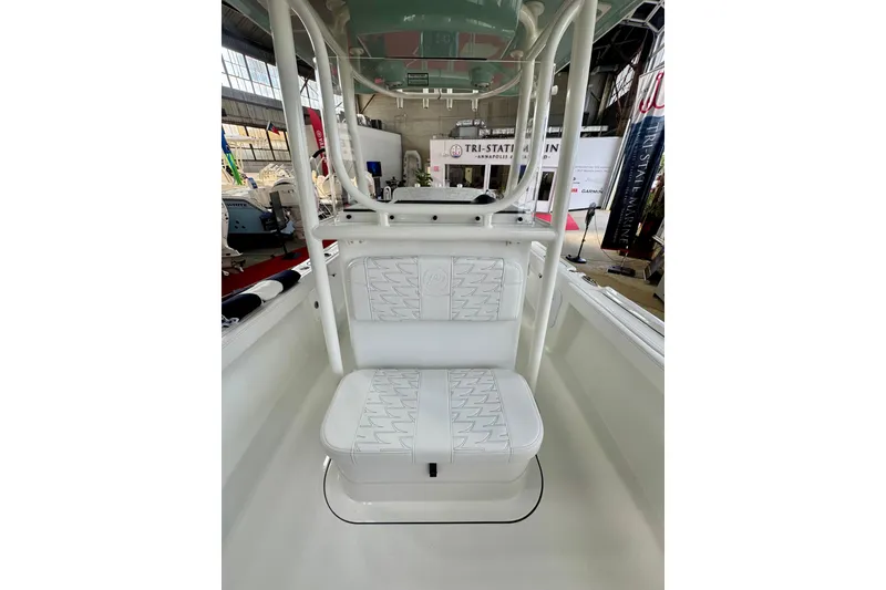 Slide: The Image of 2026 Parker 23SE Center Console boat interior with white seating and sturdy frame. - 9